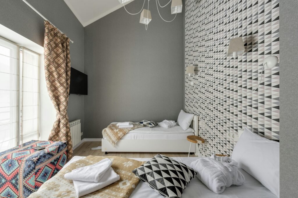 A stylish bedroom featuring geometric patterns and modern design elements.